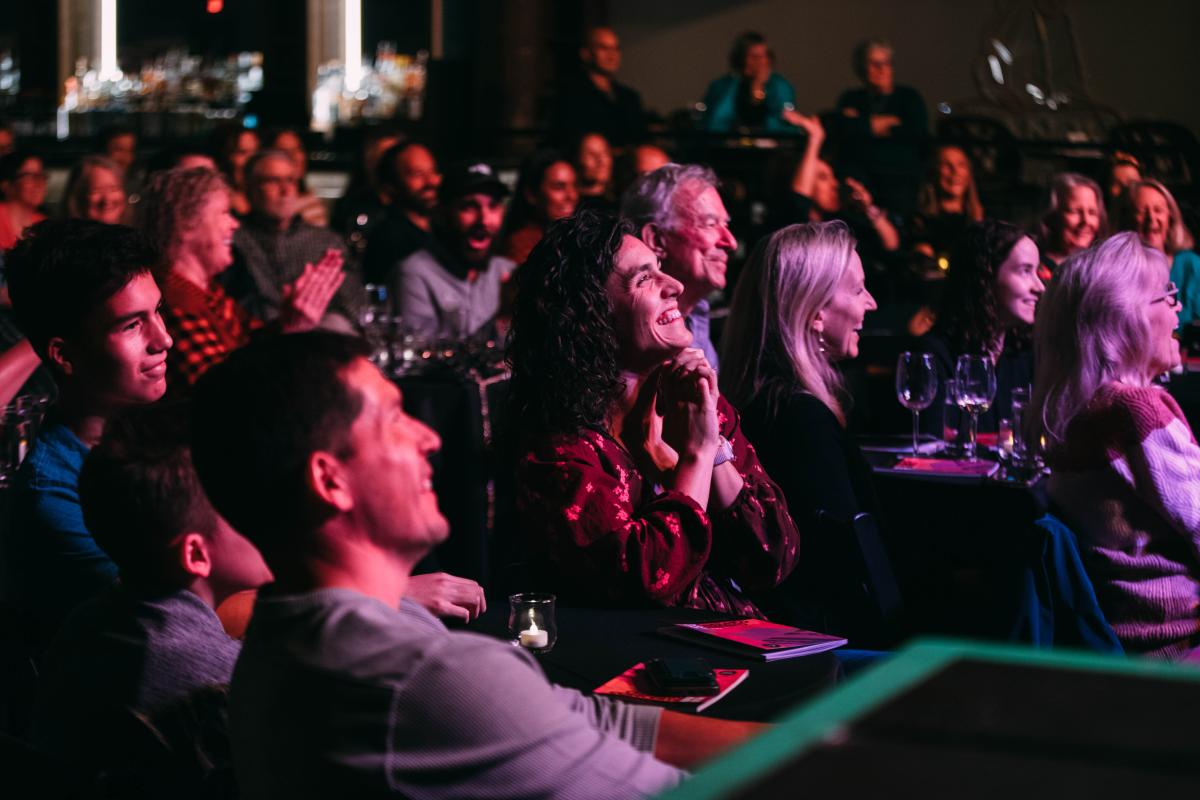 Audience members smile while attending a Cliburn Sessions performance at Tannahill's Music