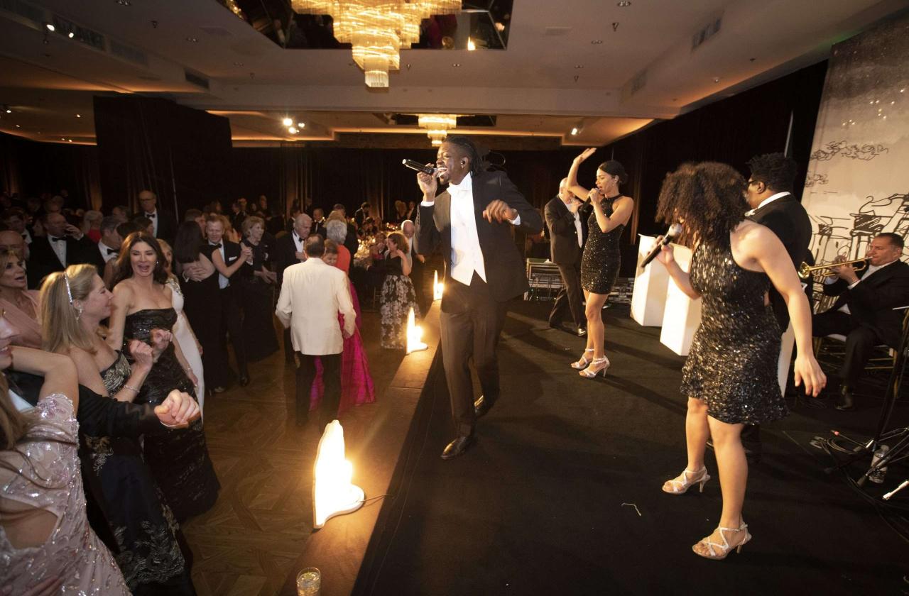 Singers on stage at a formal event