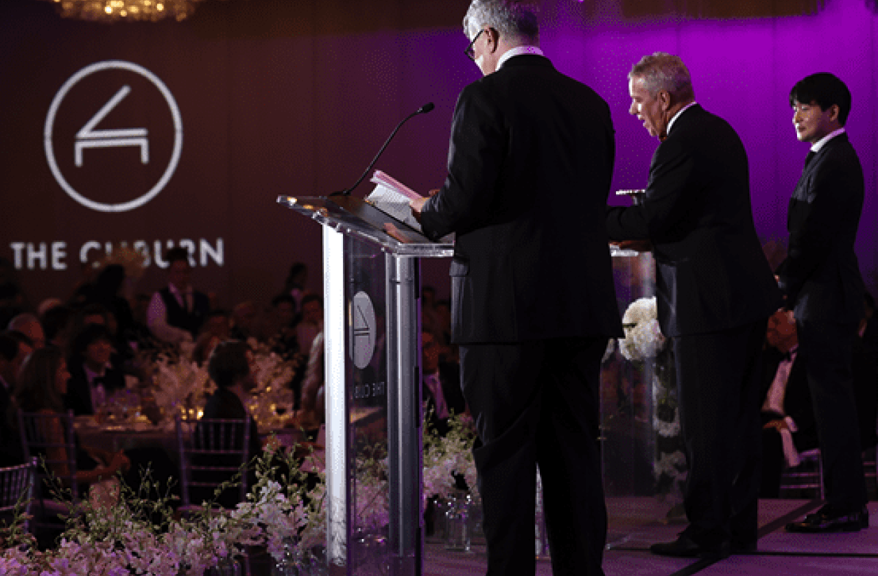 On stage at a formal ceremony 